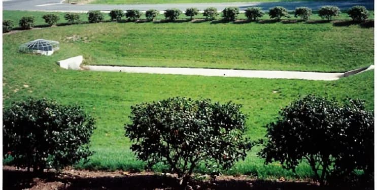 Dry detention basin with a grated outlet structure.